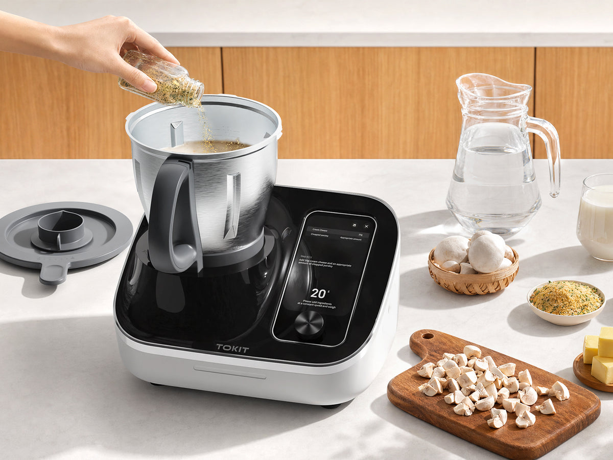 TOKIT cooker with a selection of prepared dishes